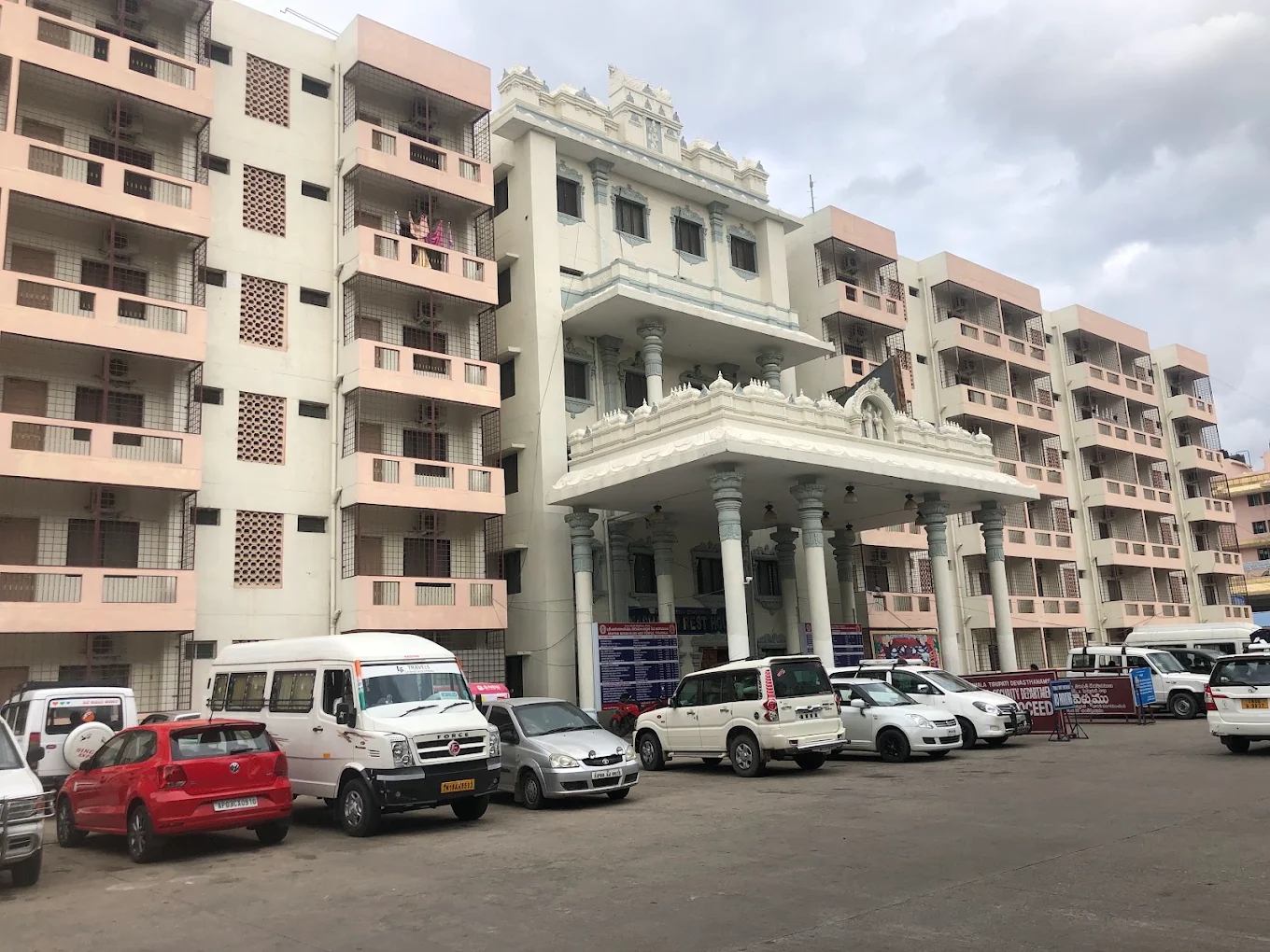 Exterior facade of Nandakam Rest House in Tirumala under morning sunlight
